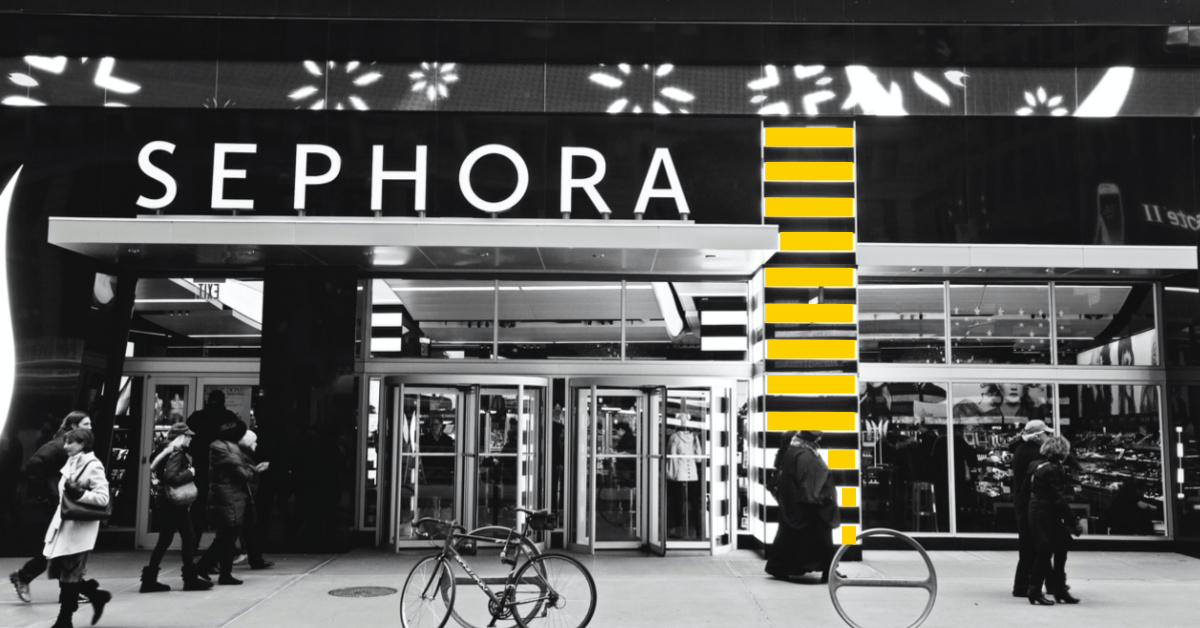 People walking in front of Sephora store front